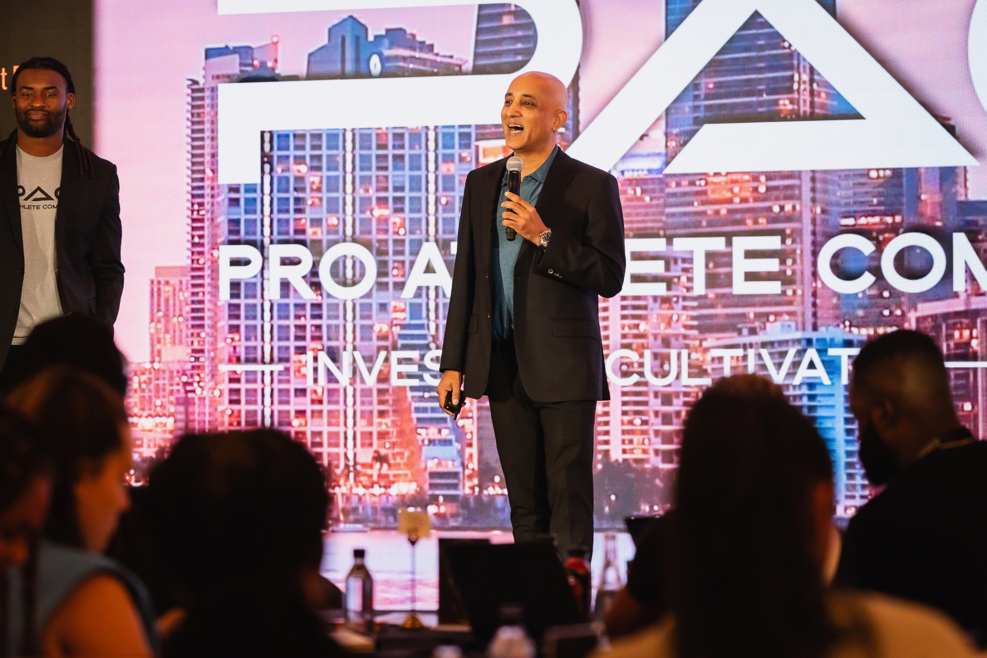 Anish Dave speaking at a Professional Athletes Community event